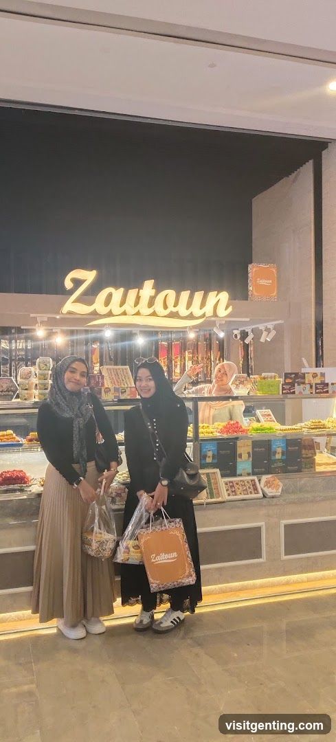 Two women posing in front of Zautoun store