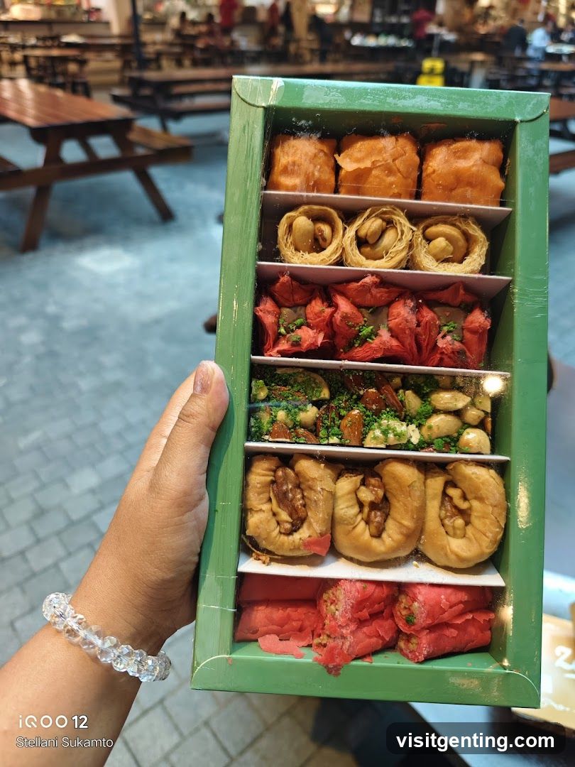 Hand holding dessert box in food court
