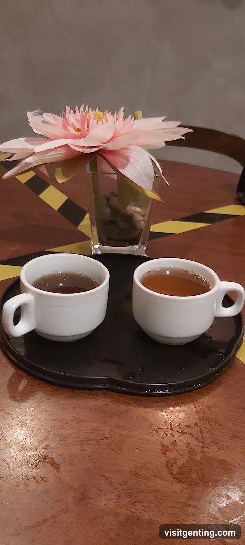 Tea cups and flower on table