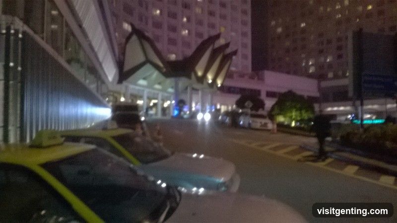 Nighttime street scene near building entrance