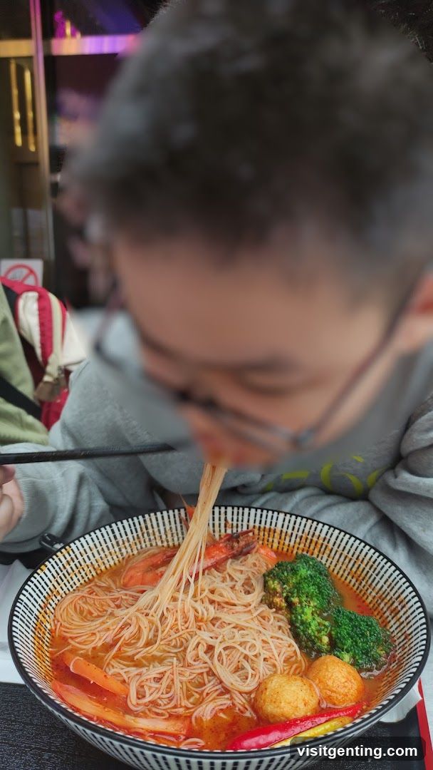 Person eating noodles
