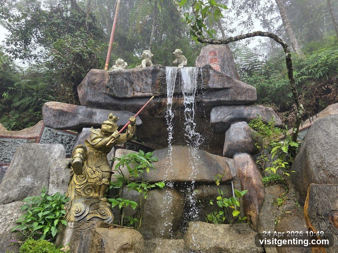 Waterfall and Statue Sculpture in Forested Area
