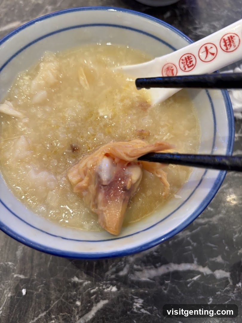 Bowl of soup with chopsticks and spoon