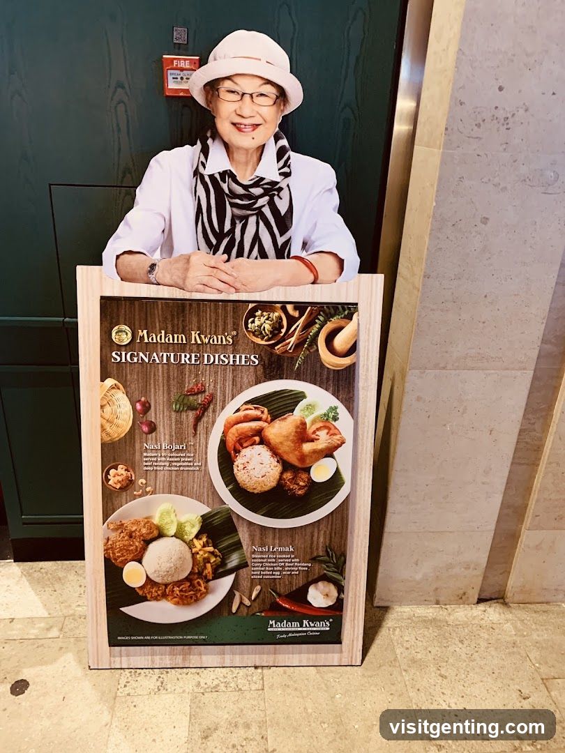 Madam Kwan's Signature Dishes Poster with Staff Member