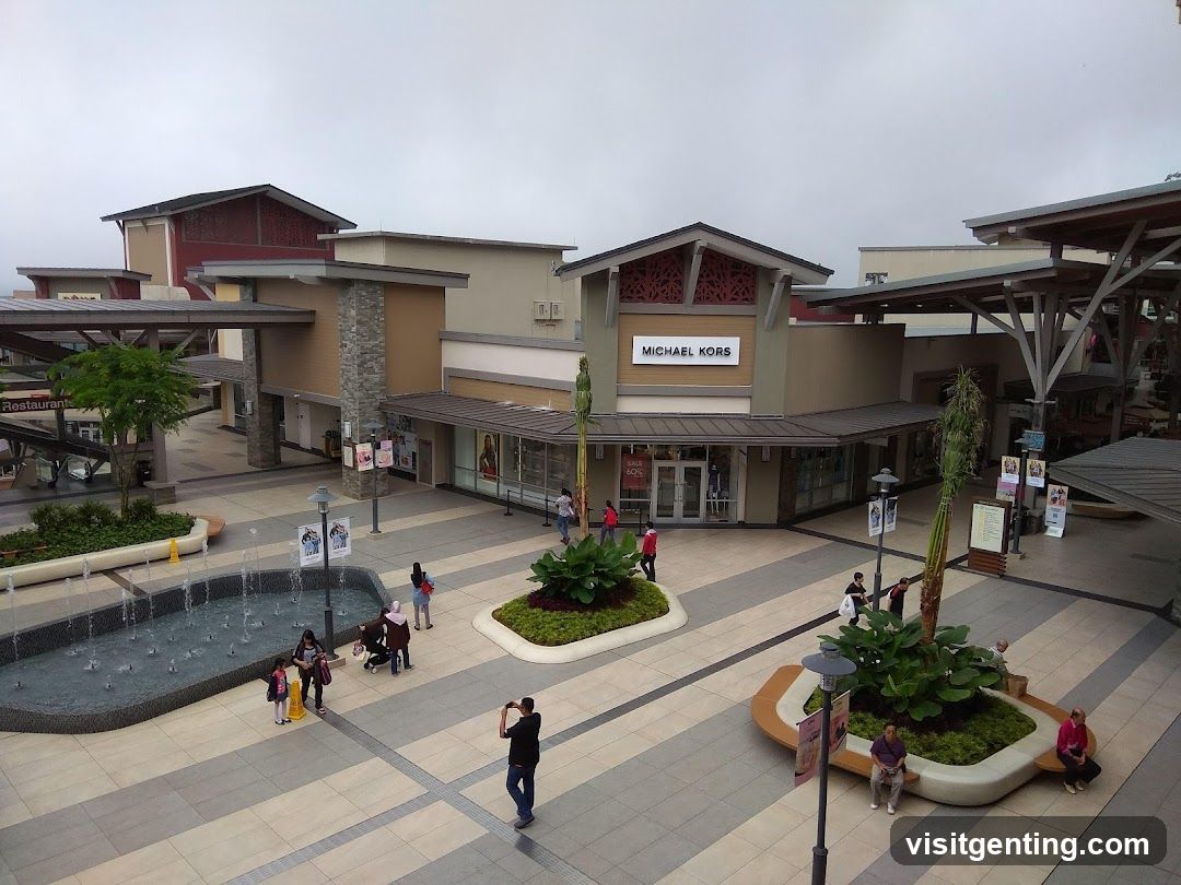 Outdoor shopping plaza with Michael Kors storefront