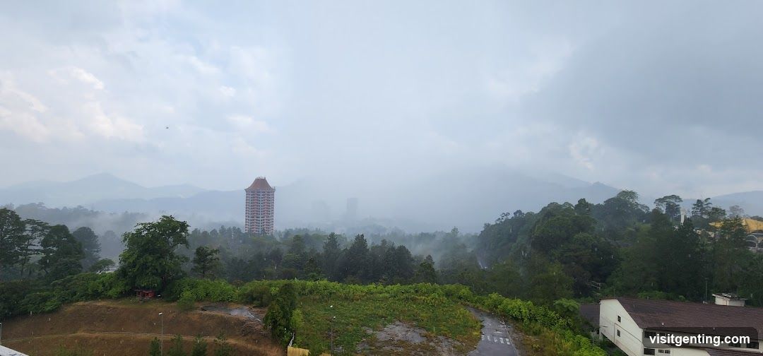 Mountainous Landscape with Fog and Buildings