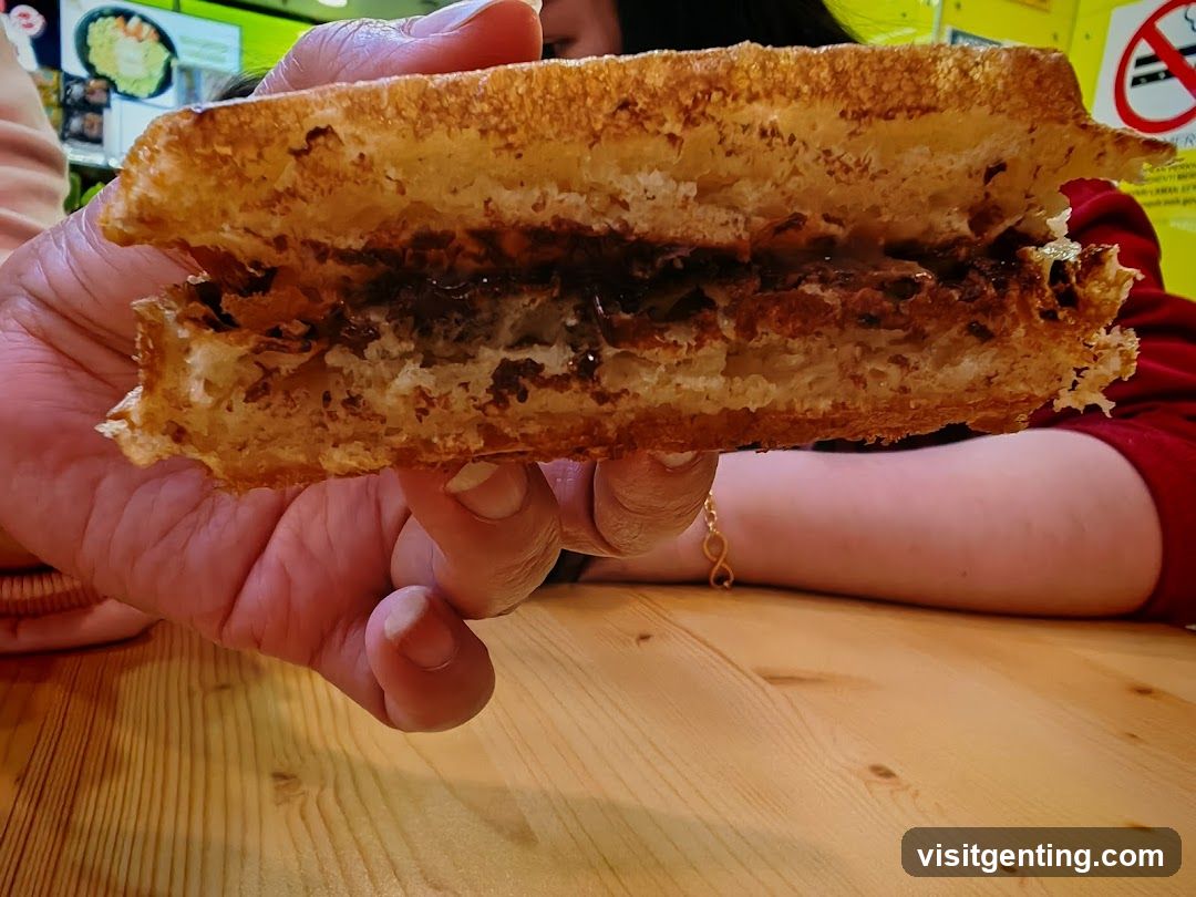 Hand holding sandwich