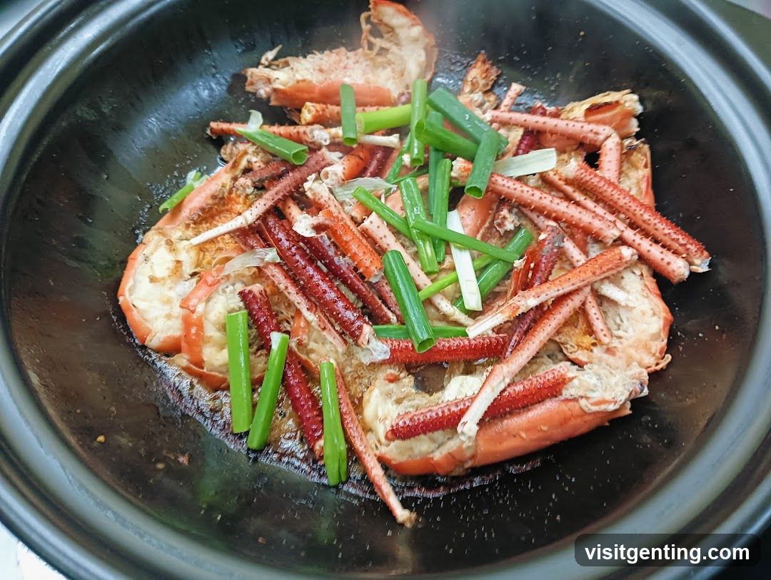 Cooked crab with green onions in a pot