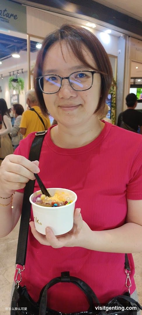 Woman holding dessert in shopping mall