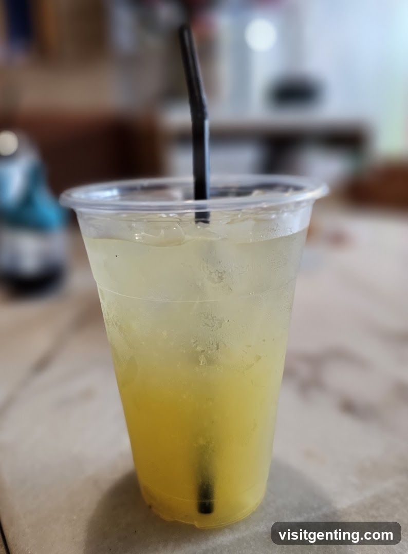 Iced beverage in plastic cup with straw
