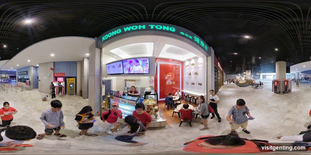 Interior of a shopping mall with Koong Woh Tong storefront