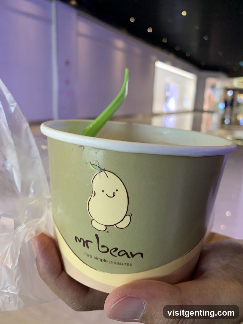 Hand holding a cup from mr bean