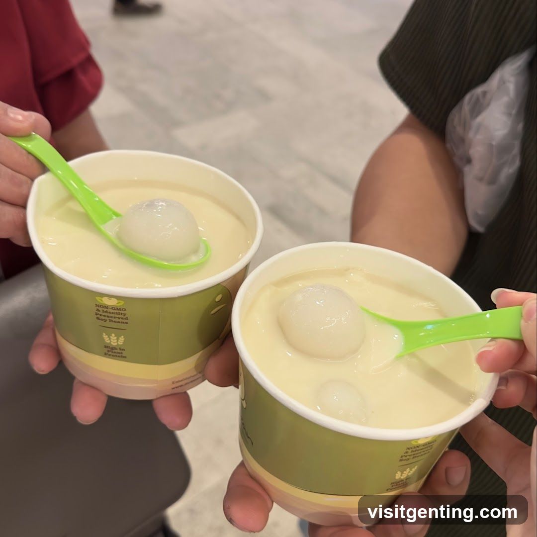 Two cups of soy-based dessert with green spoons