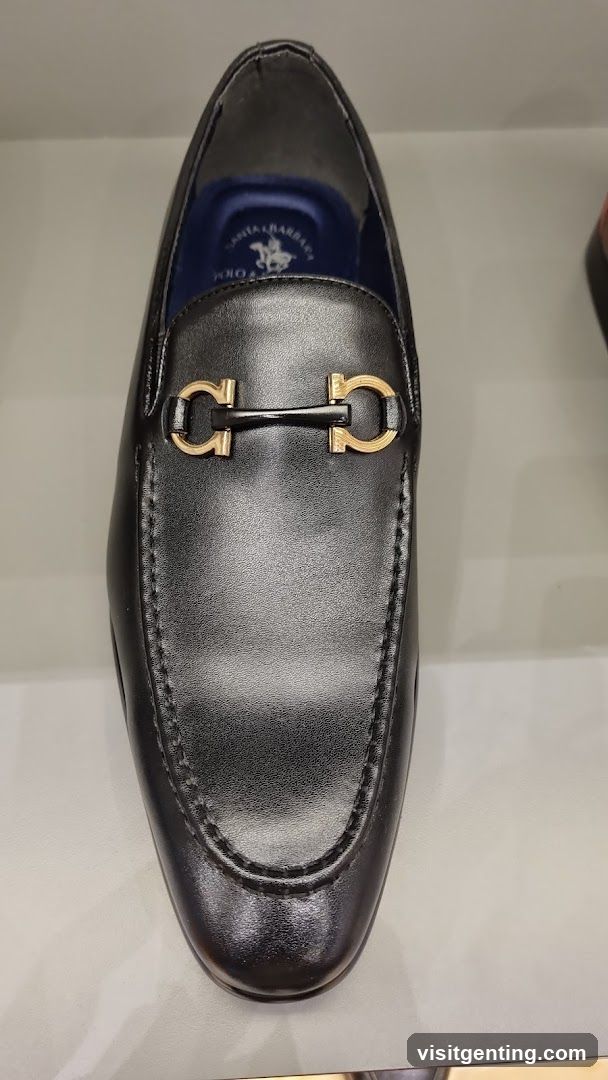 Black leather loafer with gold horsebit buckle