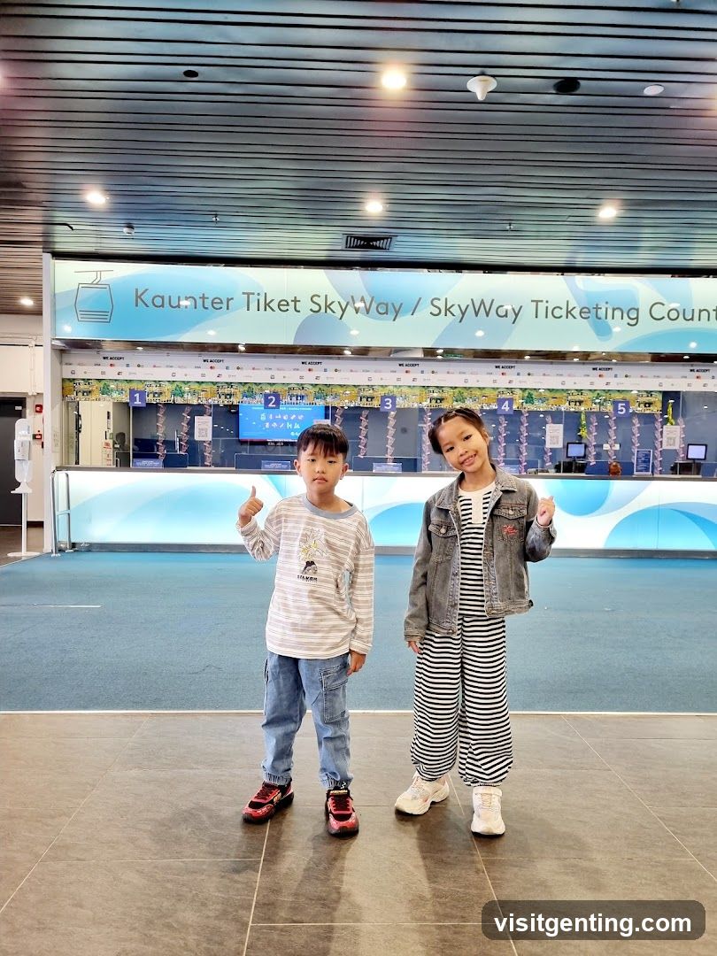 Two children posing in front of SkyWay ticketing counters