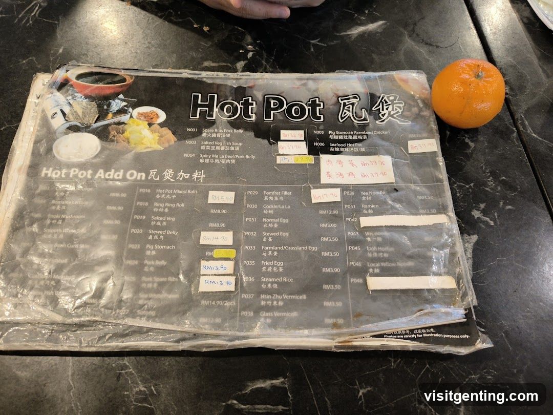 Hot Pot Menu with Orange on Table