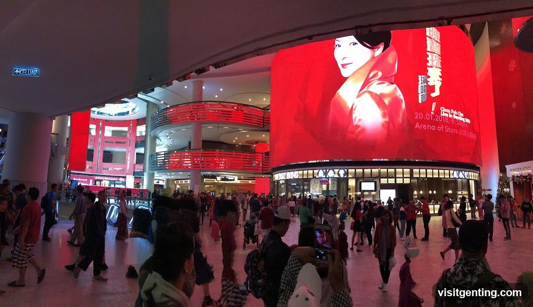 Interior of a shopping mall with large digital advertisement