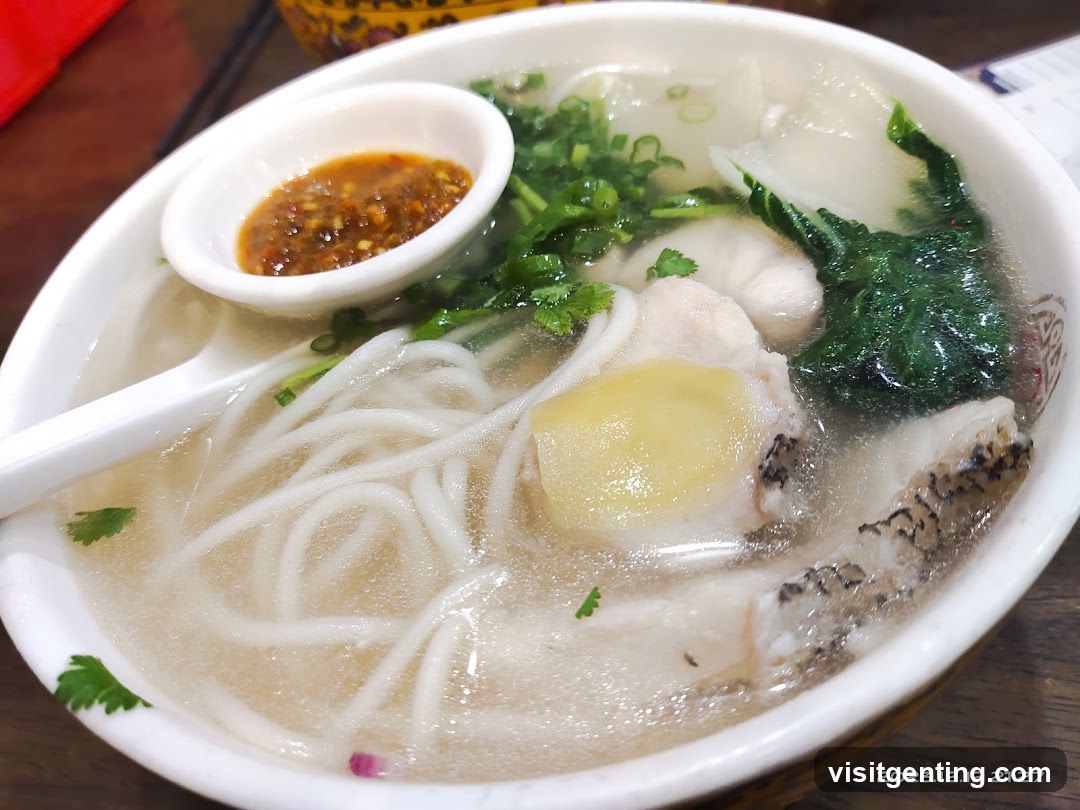 Bowl of noodle soup with side sauce