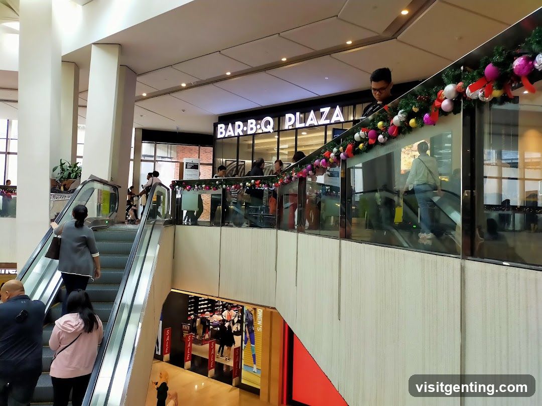Shopping Mall Interior with Escalators and Bar-B-Q Plaza Signage