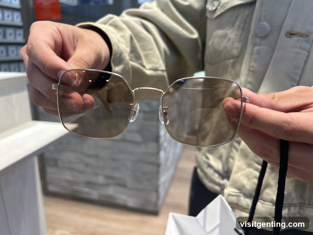 Person holding eyeglasses