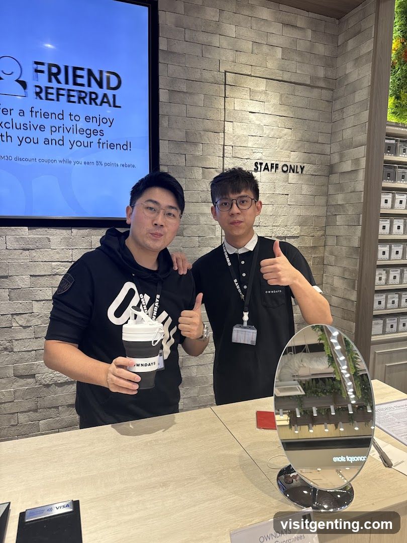 Two individuals posing at a counter