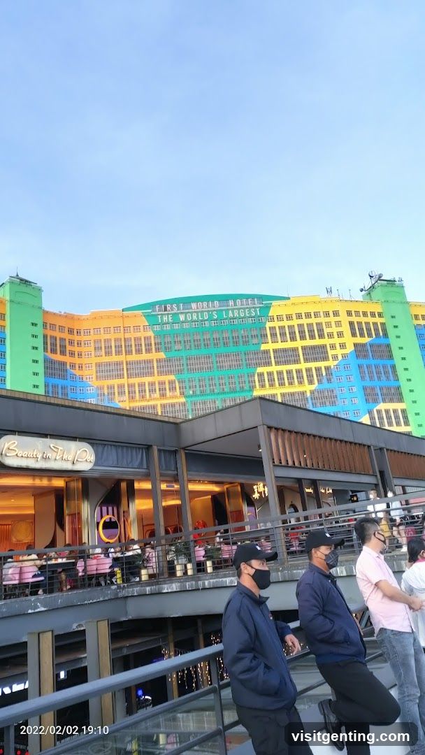 First World Hotel exterior with pedestrians
