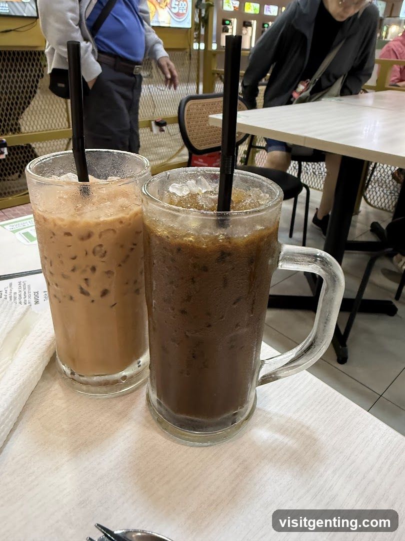 Two iced beverages on a table in a restaurant interior