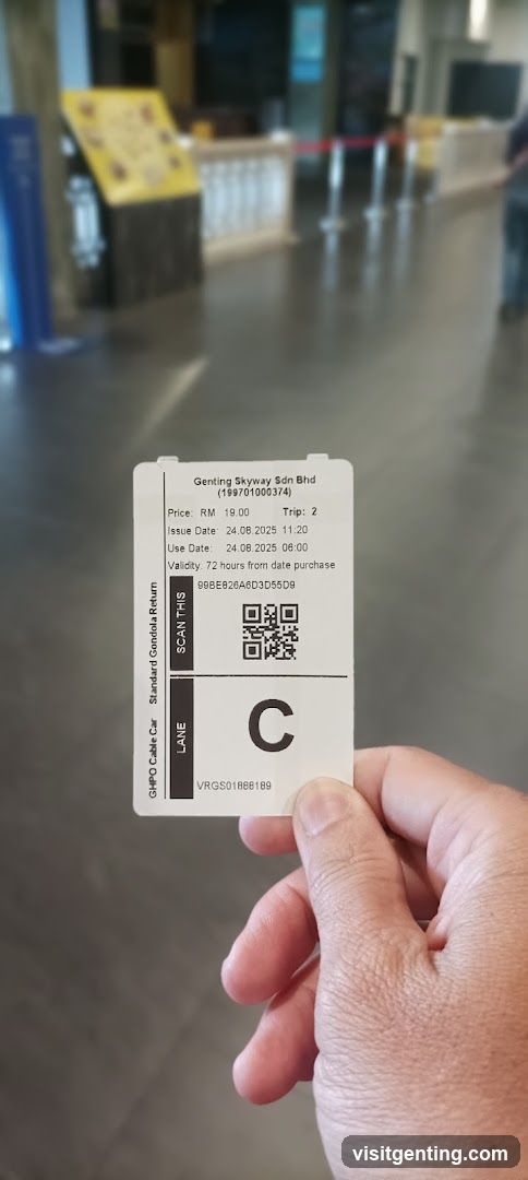 Hand holding ticket at Genting Skyway