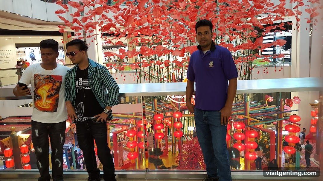 Three men posing in a shopping mall