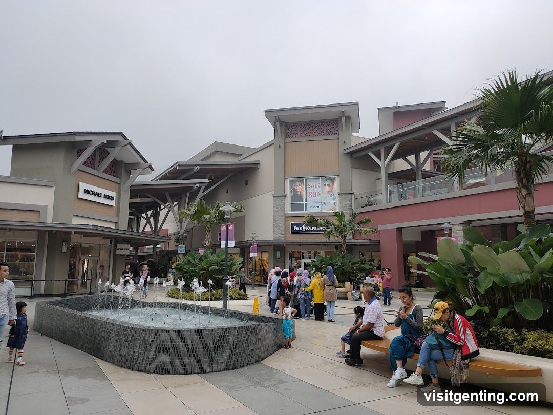 Outdoor shopping plaza with fountain and pedestrians
