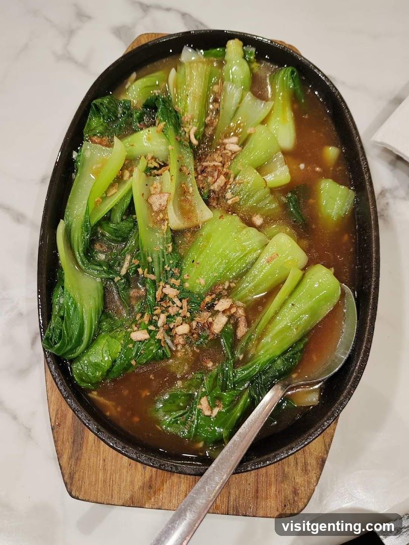 Stir-fried bok choy in a cast-iron skillet