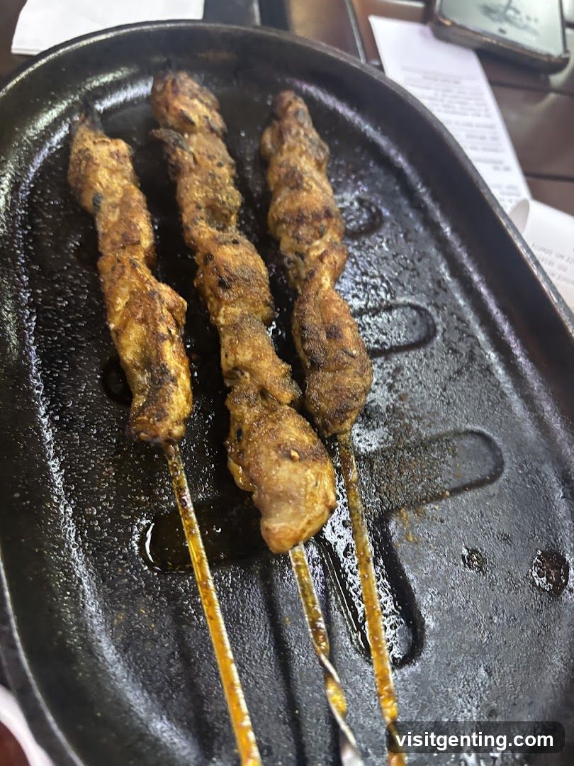 Grilled skewers on a cast iron plate