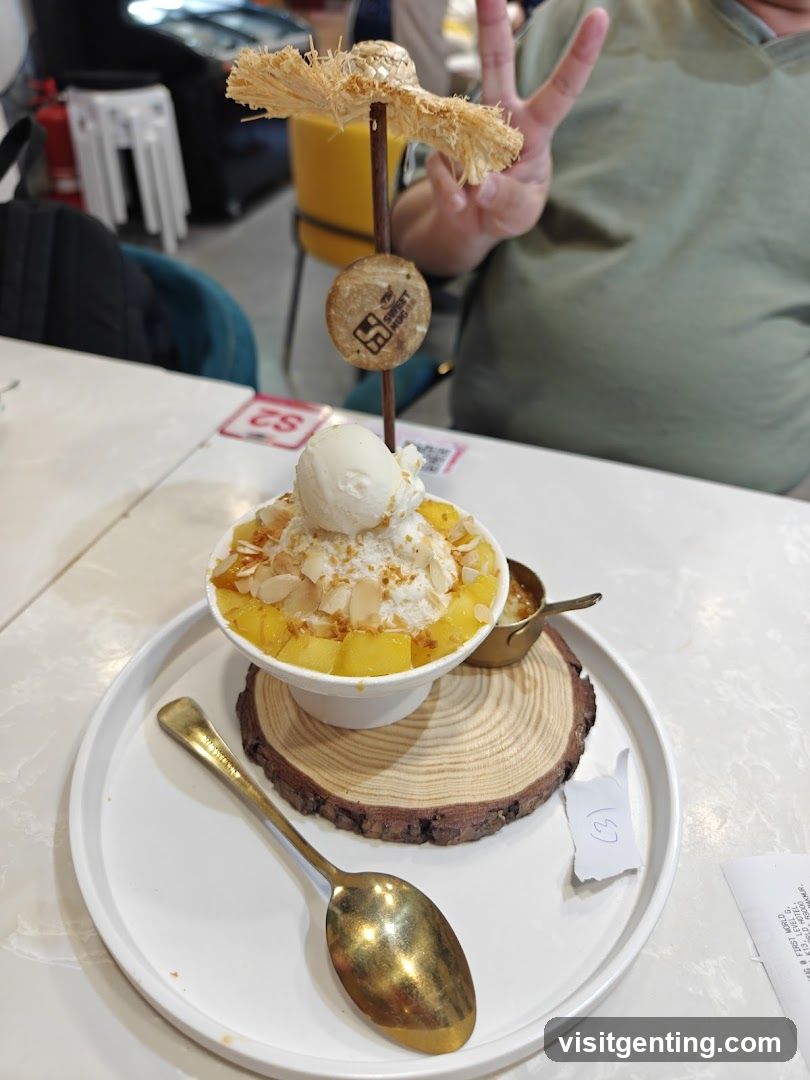 Bowl of shaved ice dessert with mango and ice cream
