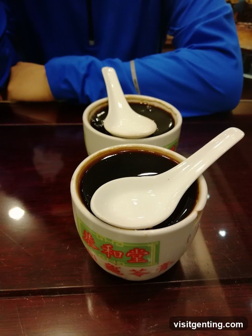 Tabletop with Two Bowls of Dark Liquid