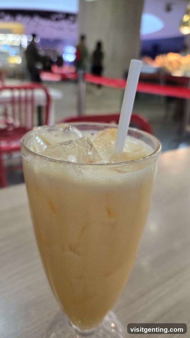 Iced beverage in a glass with straw