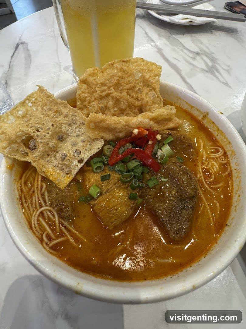 Bowl of Noodle Soup with Fried Crisp and Drink