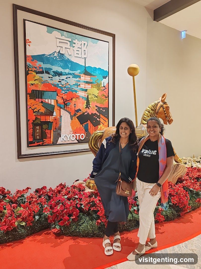 Two women posing in front of a Kyoto-themed display