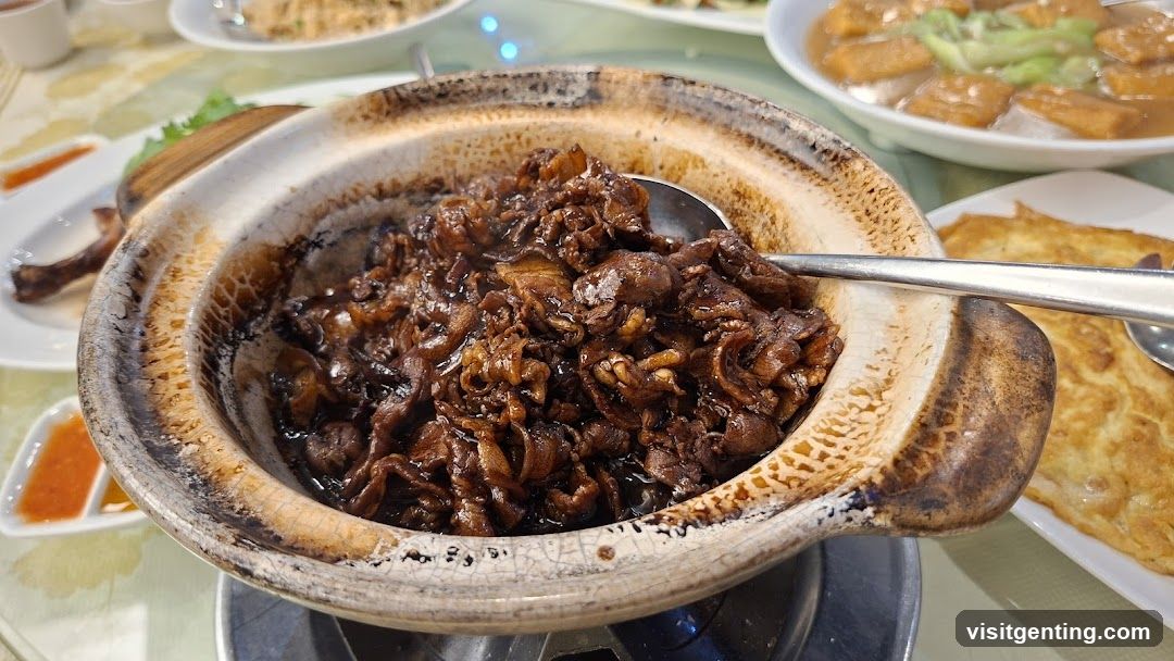 Dish in clay pot at dining table