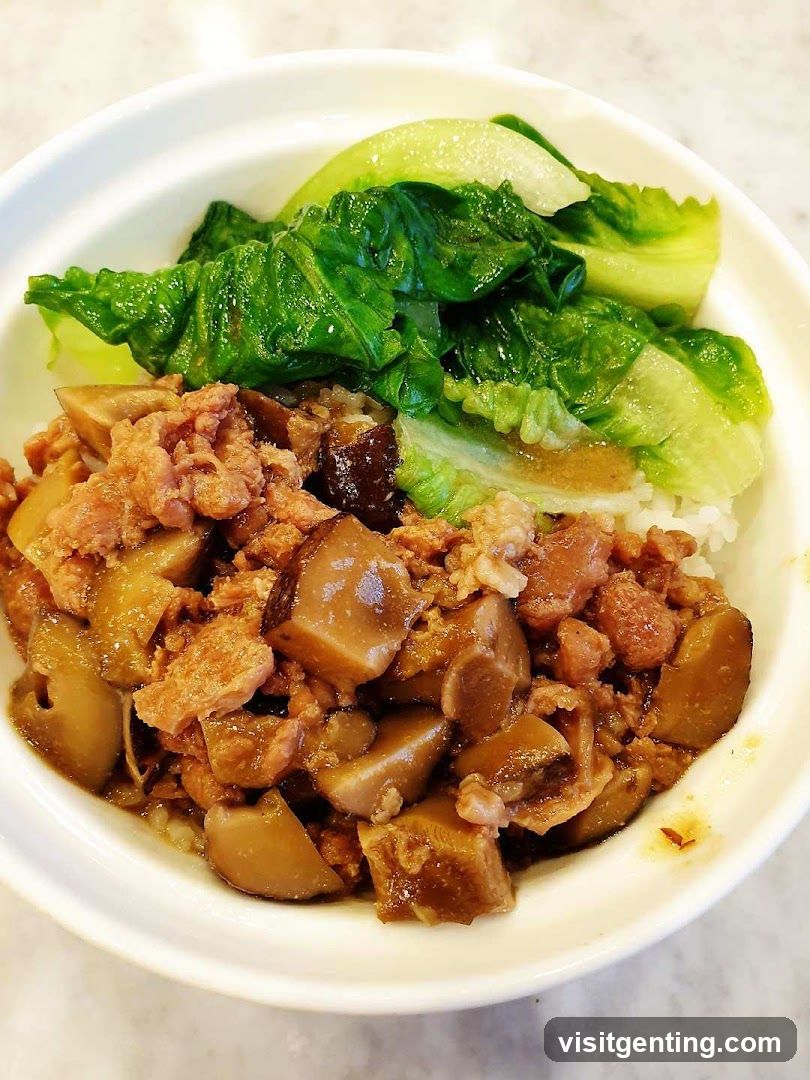 Rice bowl with stewed meat and greens