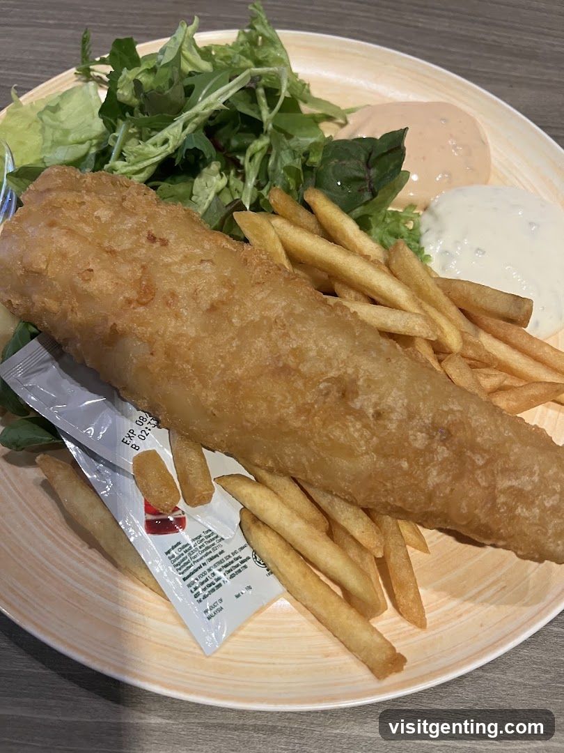 Fish and chips with salad and sauces