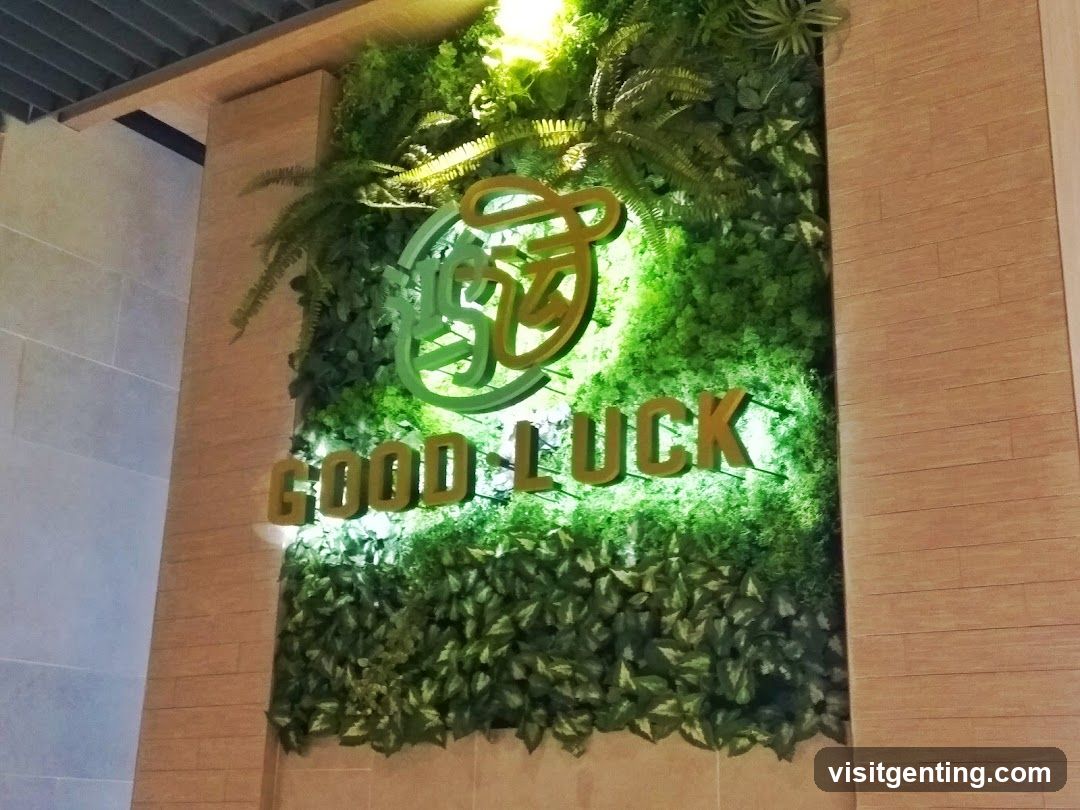 Green Wall Signage with 'GOOD LUCK' Logo