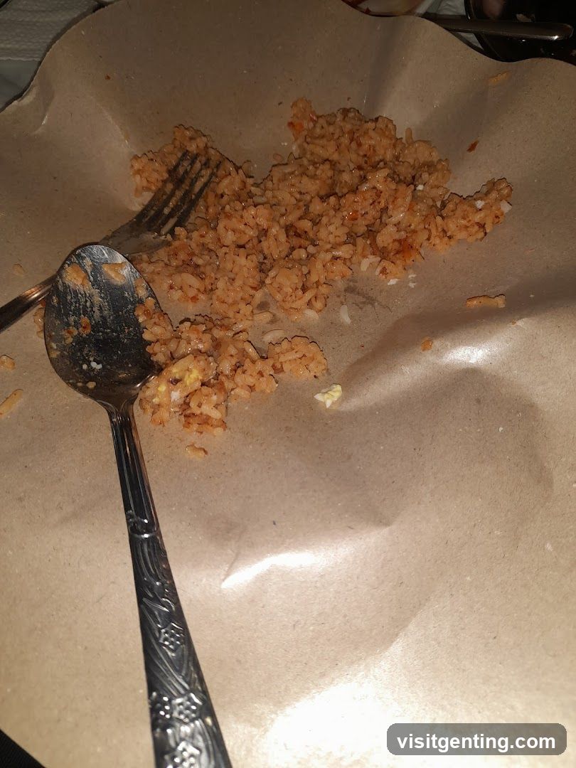 Rice dish on paper wrapper with utensils