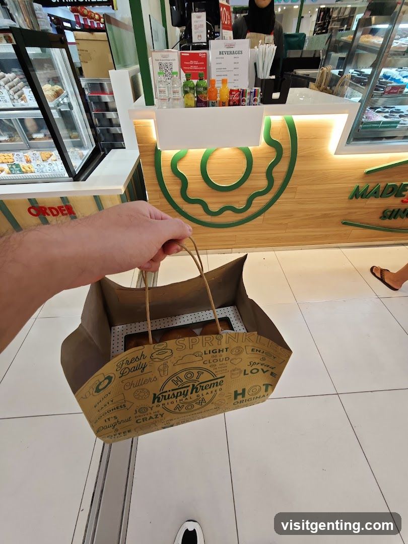 Customer holding Krispy Kreme bag in store