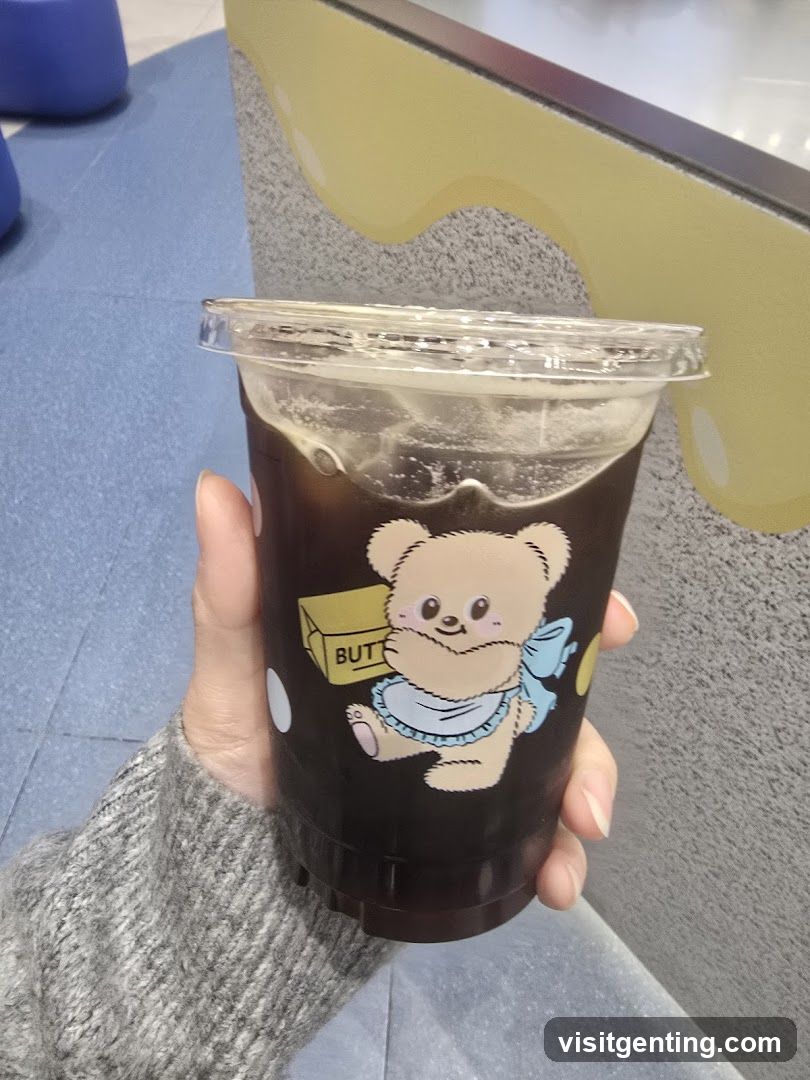 Hand holding beverage cup