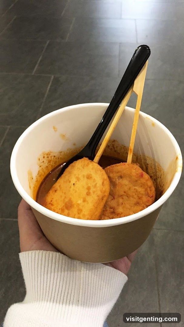 Hand holding food cup