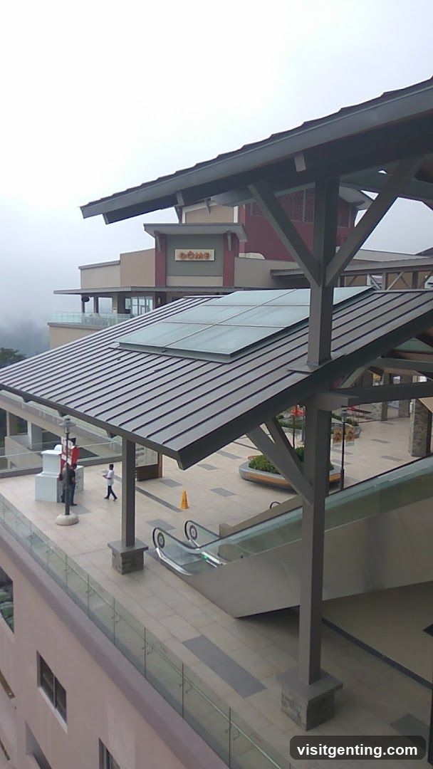 Outdoor shopping complex with escalator and covered walkway