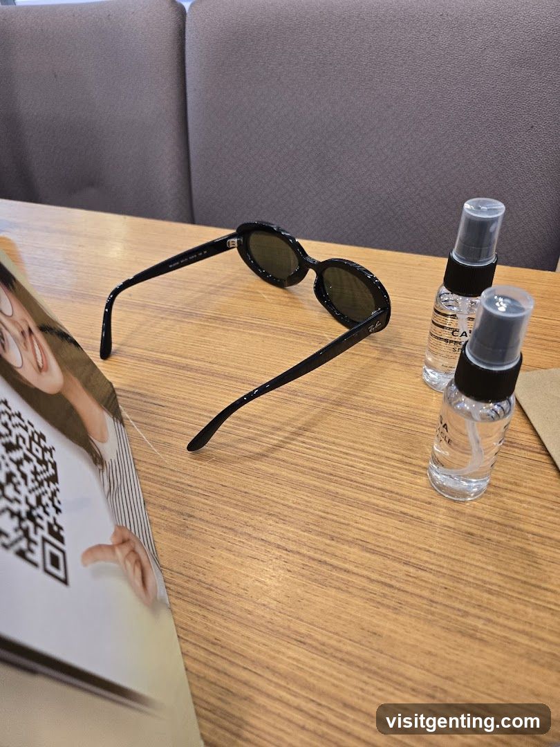 Table with sunglasses and sanitizer bottles