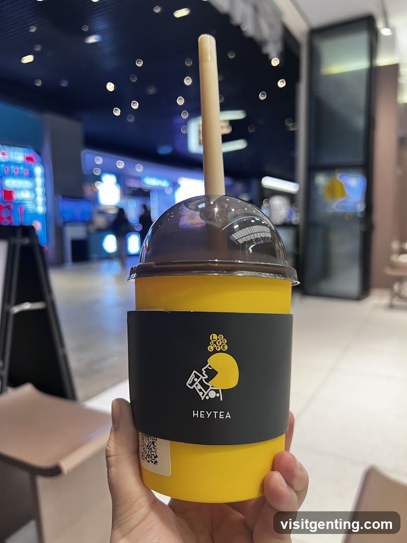 Hand holding Heytea drink