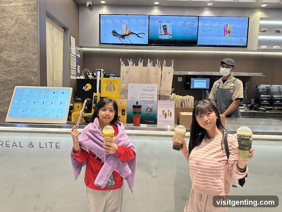 Two girls at a beverage counter