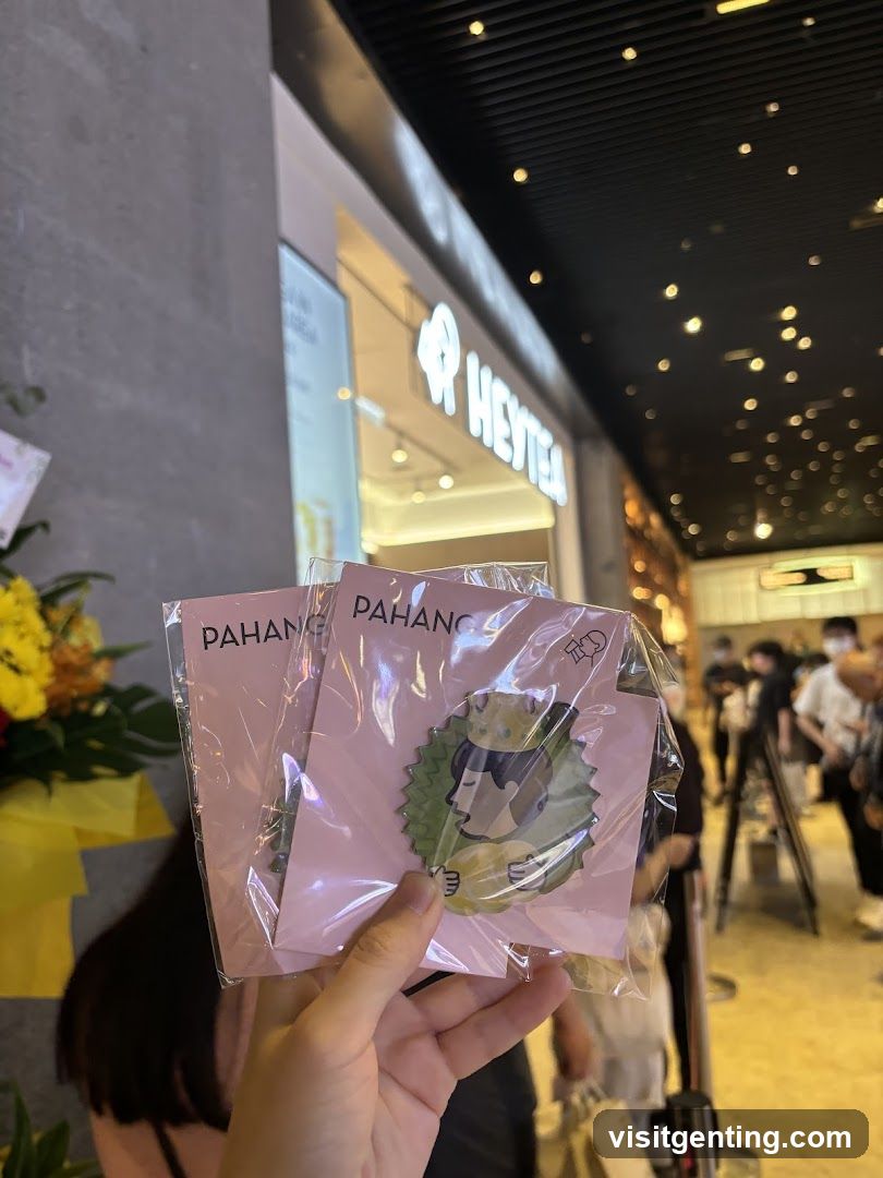 Hand holding branded merchandise